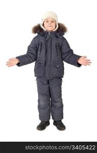 little boy in winter dress standing on white background hands at sides