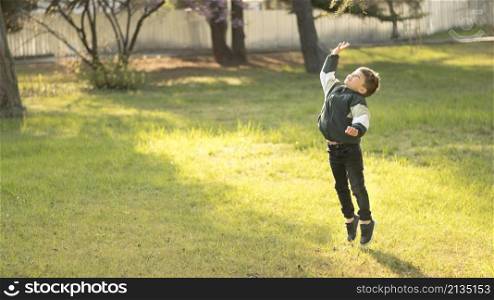little boy jumping