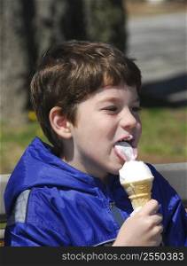 Little boy licking ice cream