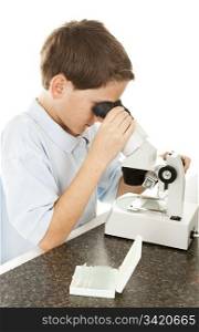 Little boy looks at slides under the microscope. Slide labels are not logos - they just describe what&rsquo;s on the slide.