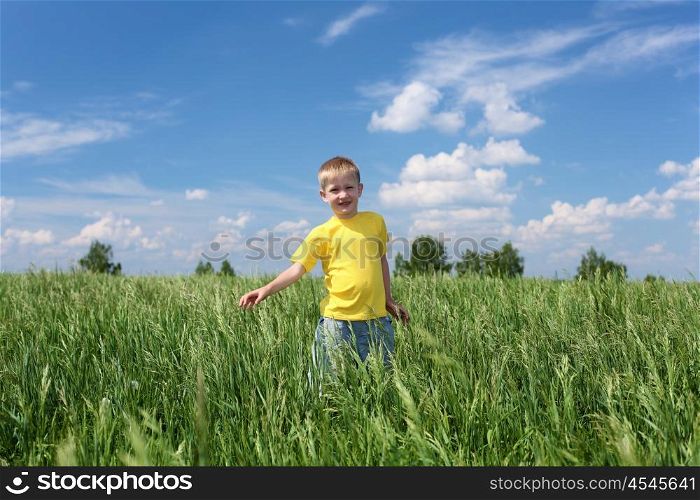 little boy outdoors in sunny summer day