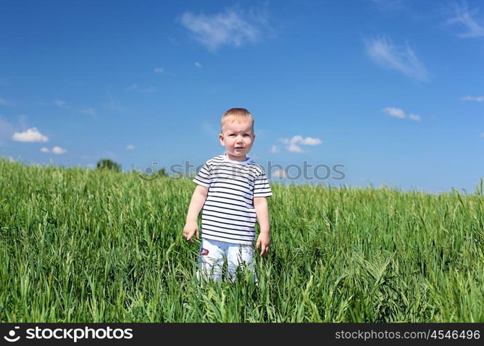 little boy outdoors in sunny summer day