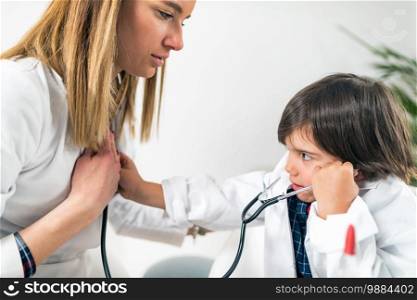 Little Boy Playing a Doctor in Pediatrician Office. Little Boy Playing a Doctor in Doctor’s Office
