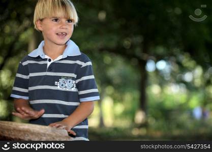 Little boy playing bongo s