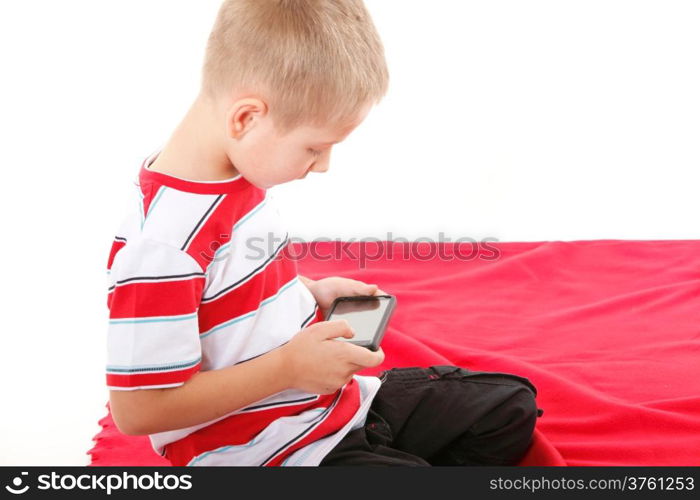 Little boy playing games on smartphone or reading a text message isolated on white background