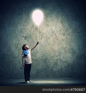 Little boy playing. Image of little cute boy playing with balloon