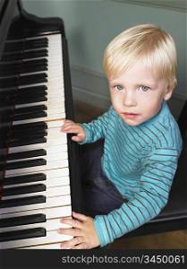 Little boy playing piano
