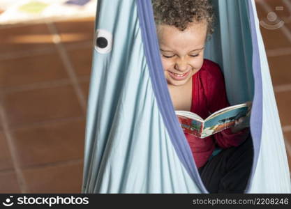 little boy reading book