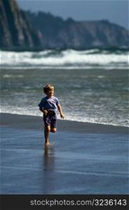 Little Boy Running on the Beach