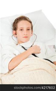 Little boy sick in bed listens to his heartbeat with a stethoscope. White background.
