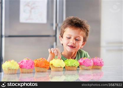 Little Boy Sneaking a Bite of Cupcake