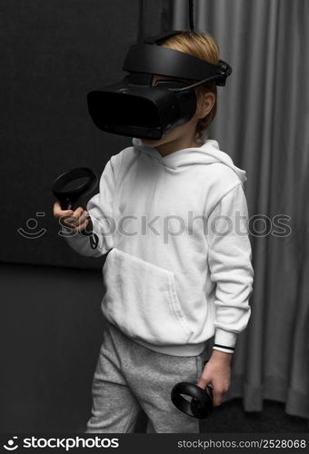 little boy using virtual reality headset