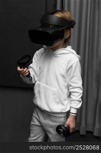 little boy using virtual reality headset
