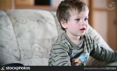 Little boy watching TV, front view