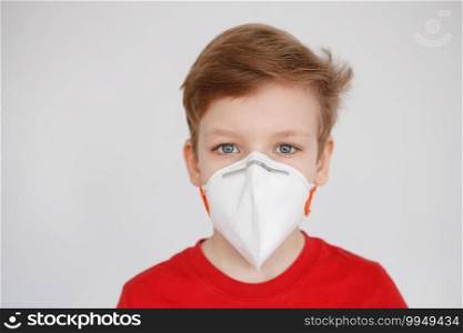 Little boy wearing a mask against corona virus covid-19, 2019-nCov. Kid in a surgical bandage or respirator during corona virus and flu outbreak. Child in a medical mask. Coronavirus quarantine.