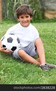 Little boy with a football