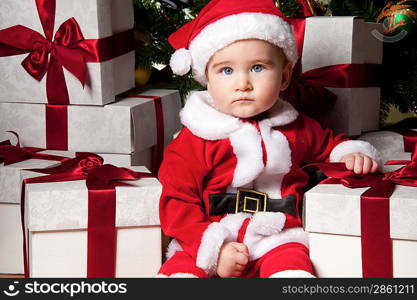 Little boy with a gift boxes.