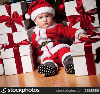 Little boy with a gift boxes.
