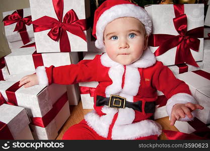 Little boy with a gift boxes.