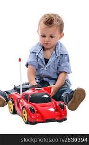 Little boy with a remote controlled car