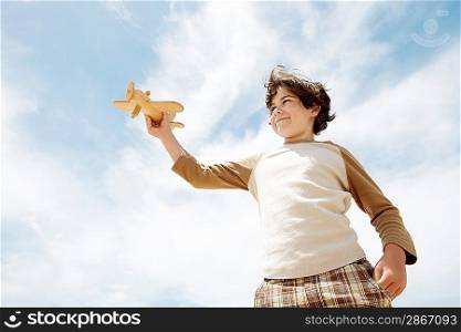 Little Boy with a Toy Airplane