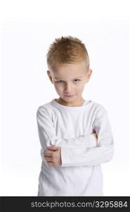 Little Boy With An Annoyed Expression On White Background