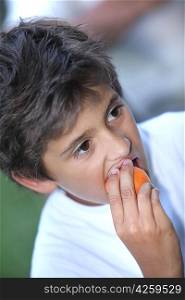 Little boy with apricot
