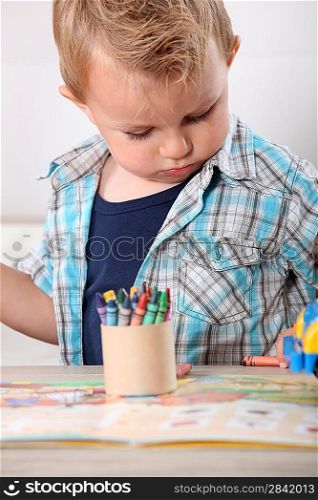 Little boy with crayons