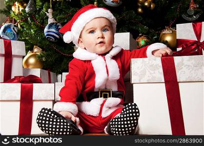 Little boy with gift boxes.