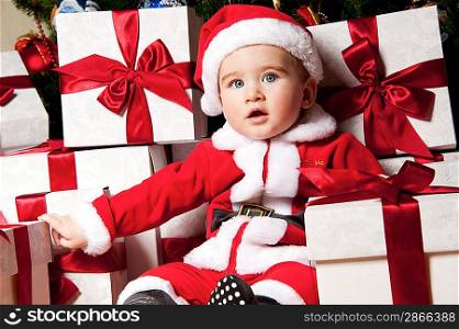 Little boy with gift boxes.