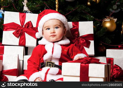 Little boy with gift boxes.