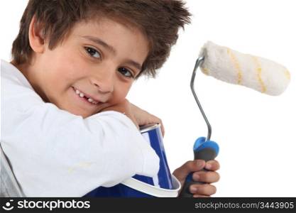 Little boy with painter accessories