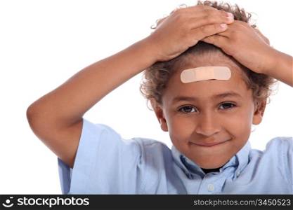 Little boy with plaster on head
