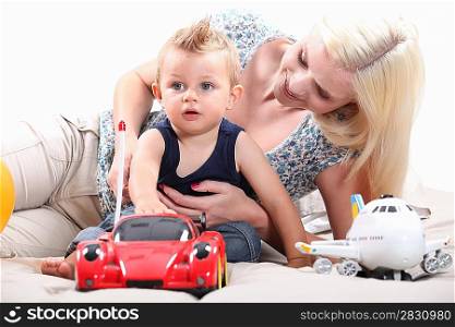 Little boy with radio-controlled car