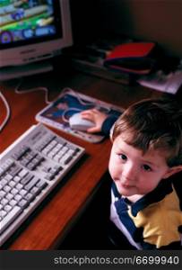 little boy working on a computer
