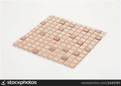 little brown ceramic tile on a white background, majolica. for the catalog. square small tile