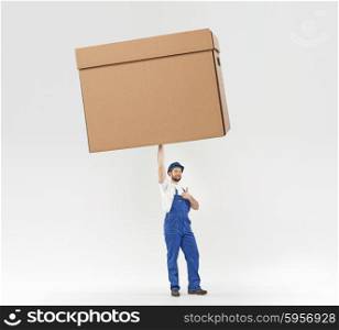 Little builder holding a huge paper box