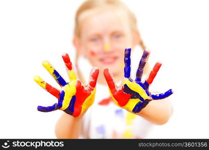 little child with hands painted in colorful paints ready for hand prints