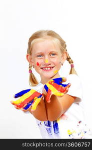 little child with hands painted in colorful paints ready for hand prints