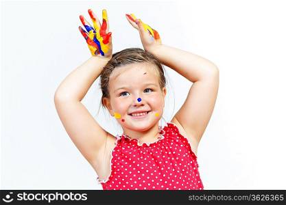 little child with hands painted in colorful paints ready for hand prints