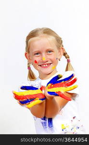 little child with hands painted in colorful paints ready for hand prints