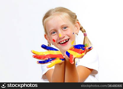 little child with hands painted in colorful paints ready for hand prints