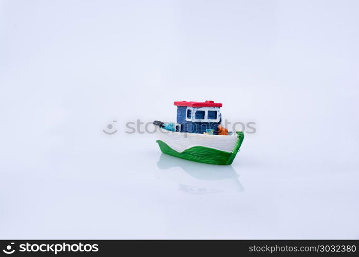 Little colorful model boat with windows. Little colorful model boat with windows on white background