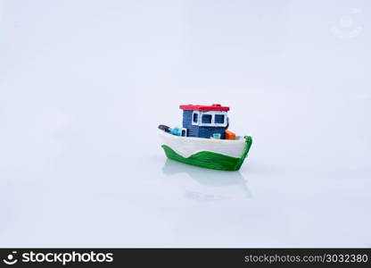 Little colorful model boat with windows. Little colorful model boat with windows on white background