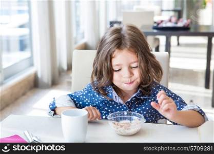 Little cute child having a tasty breakfast