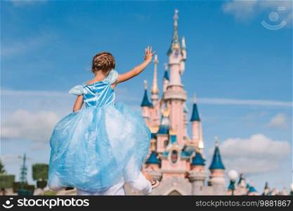 Little cute girl in beautiful princess park. Little adorable girl in beautiful princess dress at fairy-tale park