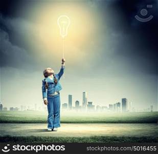 Little cute girl with bulb balloon. Image of little cute girl holding bulb balloon