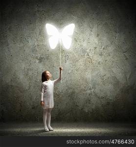 Little cute girl with butterfly balloon. Image of little cute girl holding butterfly balloon