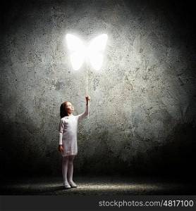 Little cute girl with butterfly balloon. Image of little cute girl holding butterfly balloon