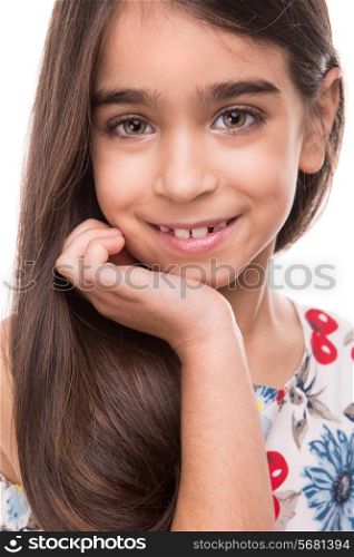 Little cute latin girl posing over white background